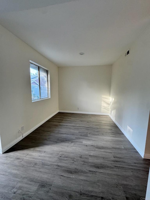 1103 Manzana Way, San Diego, CA 92139 - empty room with dark wood-style flooring and baseboards