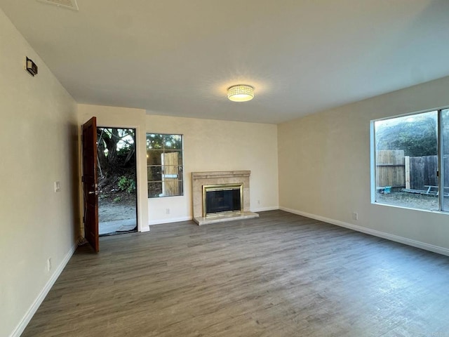 1103 Manzana Way, San Diego, CA 92139 - unfurnished living room with plenty of natural light, dark wood finished floors, and a high end fireplace