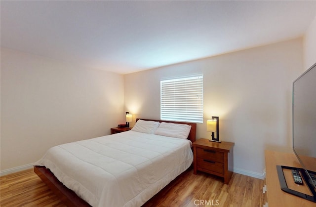 25664 Red Hawk Rd, Corona, CA 92883 - bedroom featuring light wood-type flooring and baseboards