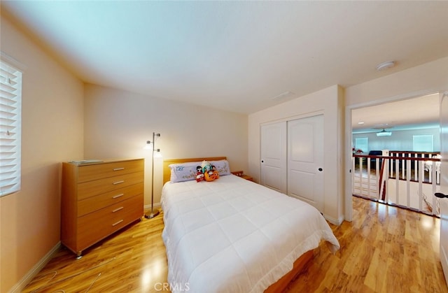 25664 Red Hawk Rd, Corona, CA 92883 - bedroom featuring light wood-style floors, a closet, and baseboards