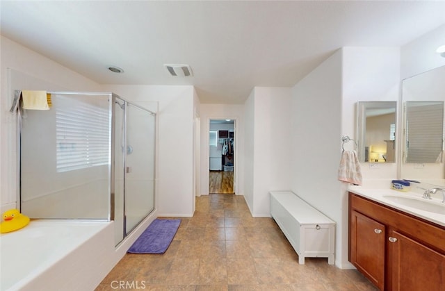 25664 Red Hawk Rd, Corona, CA 92883 - bathroom with vanity, a stall shower, a garden tub, and baseboards