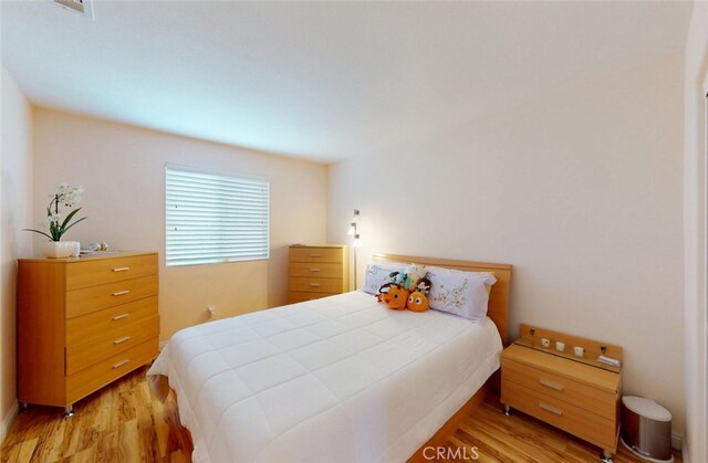 25664 Red Hawk Rd, Corona, CA 92883 - bedroom with light wood-style flooring