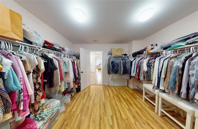 25664 Red Hawk Rd, Corona, CA 92883 - spacious closet featuring wood finished floors