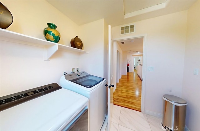 25664 Red Hawk Rd, Corona, CA 92883 - laundry room featuring washing machine and dryer and baseboards