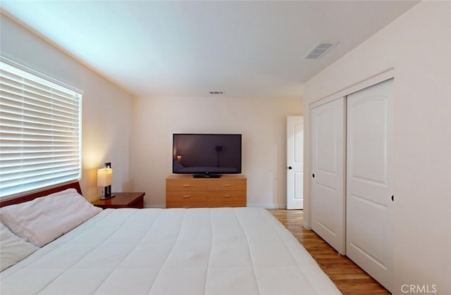 25664 Red Hawk Rd, Corona, CA 92883 - bedroom with wood finished floors and a closet