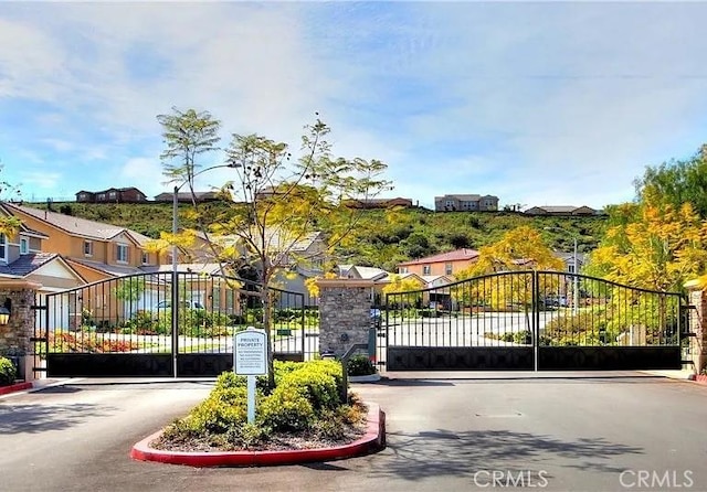 25664 Red Hawk Rd, Corona, CA 92883 - gate featuring a residential view