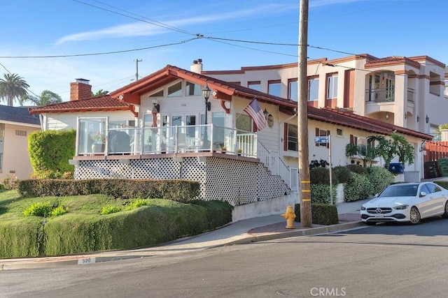 900 W 37th St, San Pedro, CA 90731 - view of front facade featuring a chimney, a tiled roof, and stucco siding