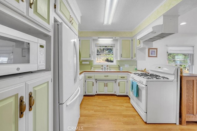 900 W 37th St, San Pedro, CA 90731 - kitchen featuring white appliances, a sink, light wood-type flooring, under cabinet range hood, and tile countertops