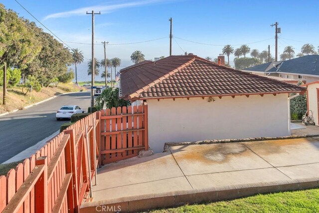 900 W 37th St, San Pedro, CA 90731 - view of side of home with a tile roof and stucco siding