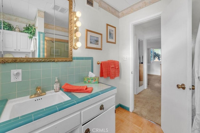 900 W 37th St, San Pedro, CA 90731 - bathroom with vanity, a shower with shower door, baseboards, and backsplash