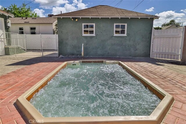 3411 W Chandler Blvd, Burbank, CA 91505 - view of swimming pool featuring an in-ground hot tub and a gate
