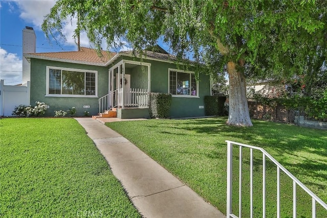 3411 W Chandler Blvd, Burbank, CA 91505 - view of front of property with stucco siding and a chimney