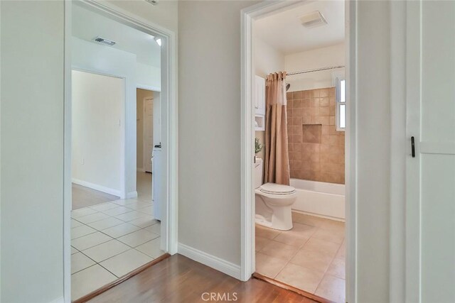 3411 W Chandler Blvd, Burbank, CA 91505 - hallway with tile patterned floors and baseboards
