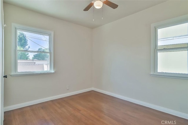 3411 W Chandler Blvd, Burbank, CA 91505 - unfurnished room featuring baseboards, wood finished floors, and a ceiling fan