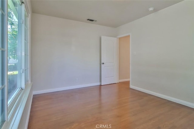 3411 W Chandler Blvd, Burbank, CA 91505 - spare room with wood finished floors, baseboards, and a smoke detector