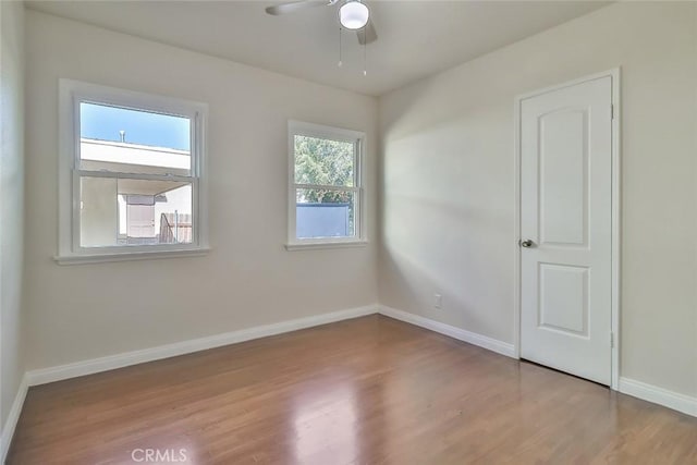 3411 W Chandler Blvd, Burbank, CA 91505 - spare room with wood finished floors, a ceiling fan, and baseboards