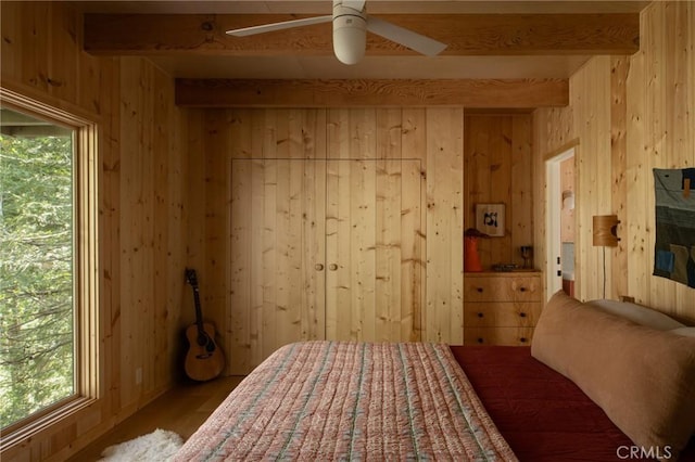 26486 Forest Ln, Twin Peaks, CA 92391 - bedroom featuring beam ceiling, wood walls, multiple windows, and wood finished floors
