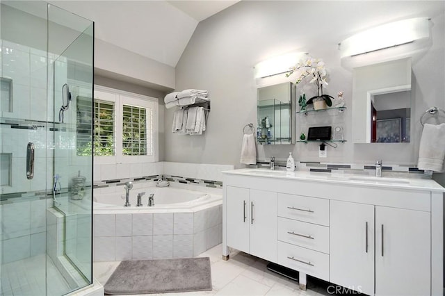 20950 Oxnard St Unit 11, Woodland Hills, CA 91367 - full bathroom featuring a garden tub, double vanity, vaulted ceiling, and a shower stall
