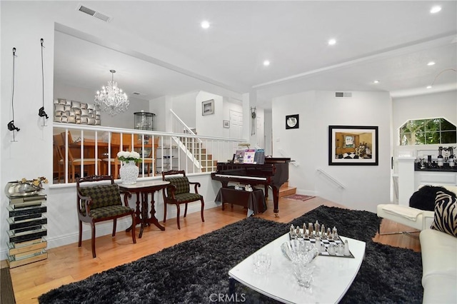20950 Oxnard St Unit 11, Woodland Hills, CA 91367 - living area with stairs, wood finished floors, a chandelier, and recessed lighting