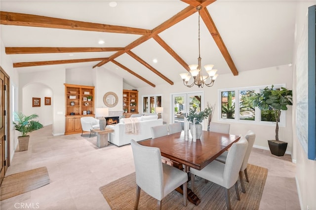 39190 Corte Venture, Temecula, CA 92592 - dining room featuring a chandelier, recessed lighting, beam ceiling, a large fireplace, and arched walkways
