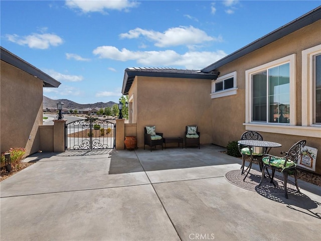 17028 Ta Ki Pi Rd, Apple Valley, CA 92307 - view of patio with a gate and a mountain view