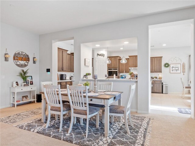 17028 Ta Ki Pi Rd, Apple Valley, CA 92307 - dining area featuring light carpet, recessed lighting, and baseboards