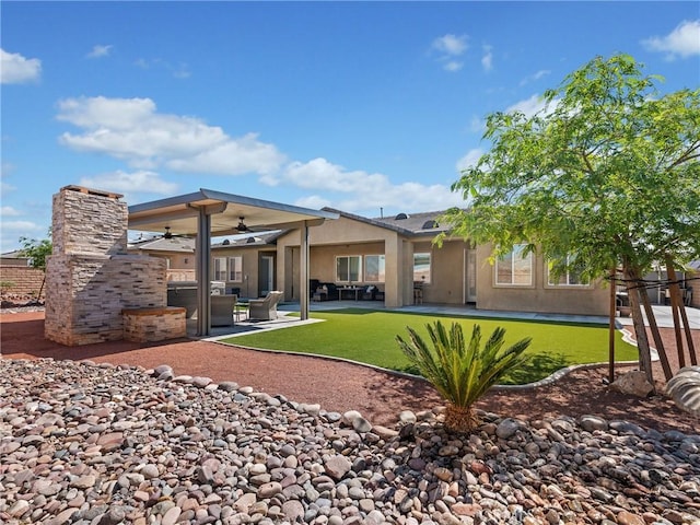 17028 Ta Ki Pi Rd, Apple Valley, CA 92307 - rear view of property with ceiling fan, a patio area, stucco siding, and a yard