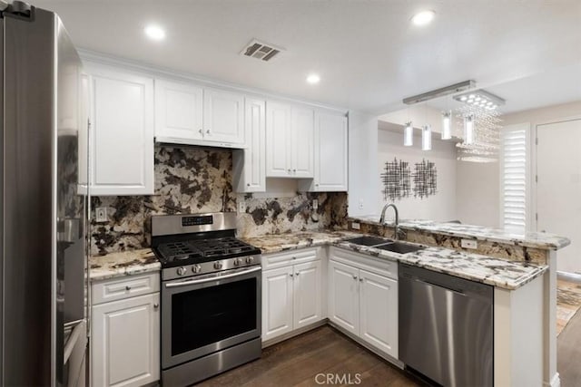 89 E Commonwealth Ave Unit 1P, Alhambra, CA 91801 - kitchen featuring stainless steel appliances, a peninsula, white cabinets, dark wood-style flooring, and recessed lighting