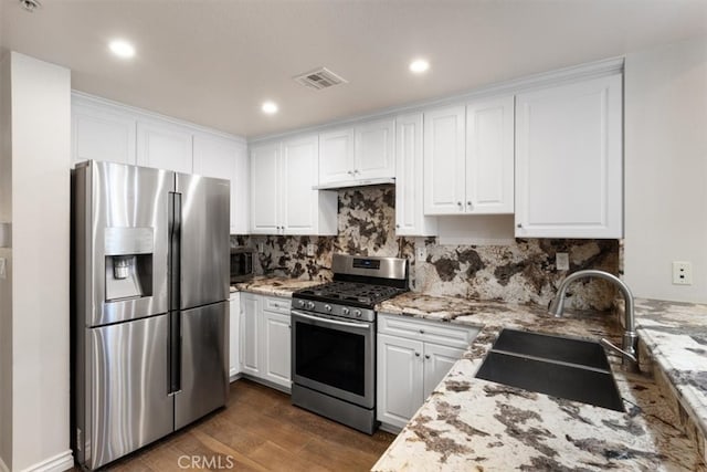 89 E Commonwealth Ave Unit 1P, Alhambra, CA 91801 - kitchen with appliances with stainless steel finishes, dark wood-type flooring, white cabinetry, and recessed lighting