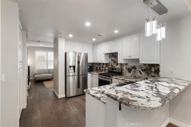 89 E Commonwealth Ave Unit 1P, Alhambra, CA 91801 - kitchen featuring appliances with stainless steel finishes, a peninsula, light stone countertops, white cabinets, and backsplash