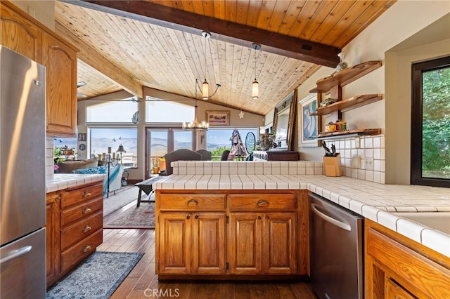 1760 Stuart St, Cambria, CA 93428 - kitchen featuring appliances with stainless steel finishes, dark wood finished floors, wood ceiling, a peninsula, and brown cabinetry