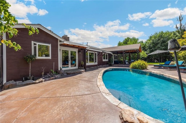 5121 E Lomita Ave, Orange, CA 92869 - swimming pool with french doors and a patio