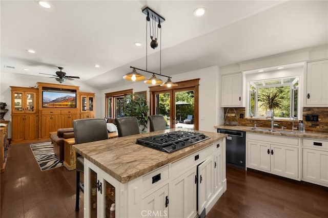5121 E Lomita Ave, Orange, CA 92869 - kitchen featuring dishwasher, a sink, gas cooktop, dark wood finished floors, and tasteful backsplash