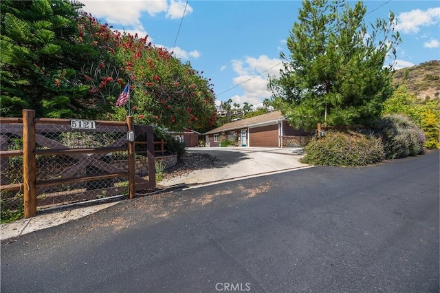 5121 E Lomita Ave, Orange, CA 92869 - obstructed view of property with a gate and a garage