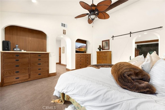 5121 E Lomita Ave, Orange, CA 92869 - carpeted bedroom featuring arched walkways, baseboards, a barn door, ceiling fan, and high vaulted ceiling