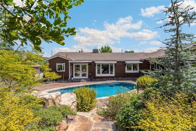 5121 E Lomita Ave, Orange, CA 92869 - back of house featuring french doors and an outdoor pool