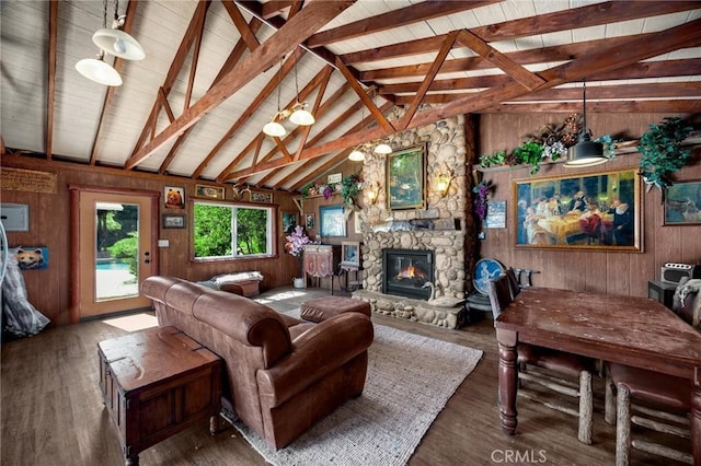 5121 E Lomita Ave, Orange, CA 92869 - living area with wooden walls, a stone fireplace, wood finished floors, and wooden ceiling