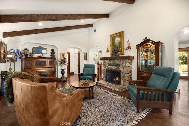 5121 E Lomita Ave, Orange, CA 92869 - living area featuring arched walkways, a stone fireplace, wood finished floors, and recessed lighting
