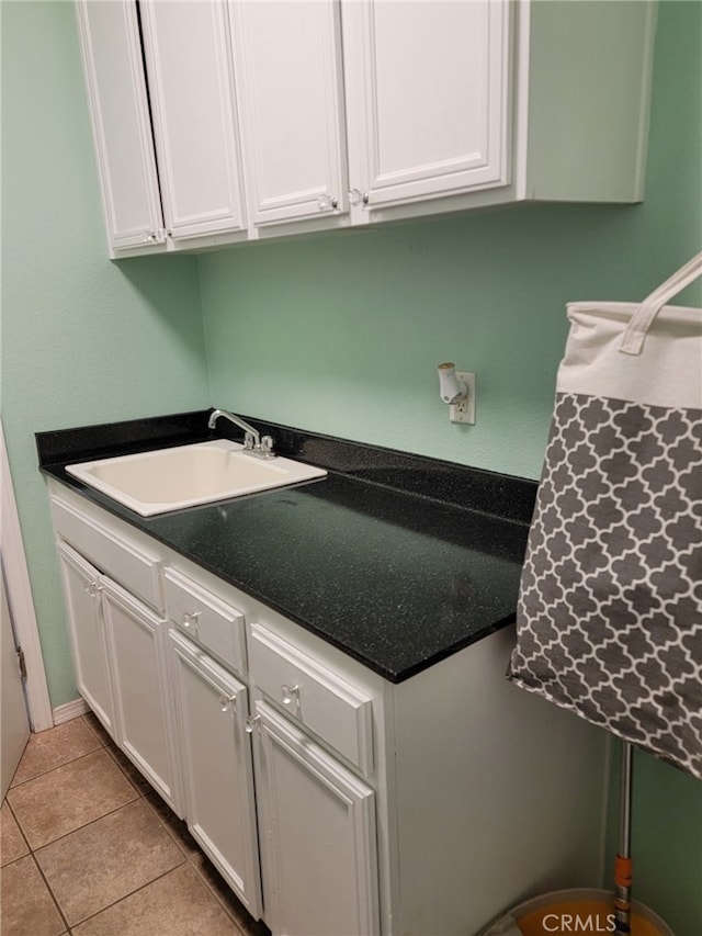 3052 Clapper St, Perris, CA 92571 - kitchen featuring a sink, white cabinetry, and light tile patterned floors