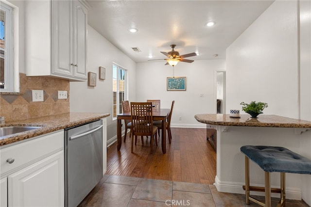 4033 N N Lang Ave, Covina, CA 91722 - kitchen featuring stainless steel dishwasher, dark wood-style floors, baseboards, ceiling fan, and decorative backsplash