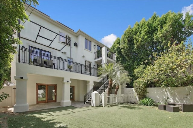 4322 Alcove Ave, Studio City, CA 91604 - back of property featuring stairway, stucco siding, a patio, and a balcony