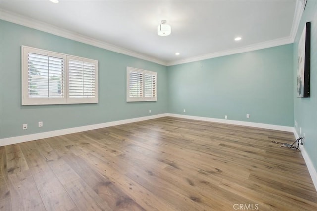 4322 Alcove Ave, Studio City, CA 91604 - spare room featuring crown molding, wood finished floors, baseboards, and recessed lighting