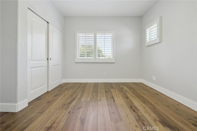 4322 Alcove Ave, Studio City, CA 91604 - unfurnished bedroom with hardwood / wood-style flooring, baseboards, and a closet
