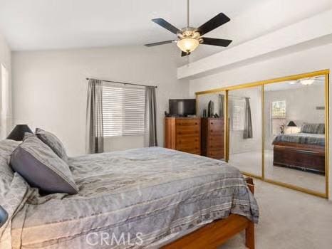 11191 Baker Ln, Riverside, CA 92505 - bedroom with vaulted ceiling, carpet, a closet, and ceiling fan