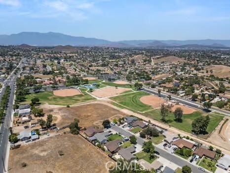 11191 Baker Ln, Riverside, CA 92505 - aerial overview of property's location with mountains and nearby suburban area