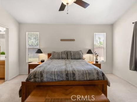 11191 Baker Ln, Riverside, CA 92505 - bedroom featuring multiple windows, light carpet, and ceiling fan