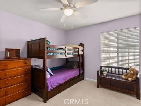 11191 Baker Ln, Riverside, CA 92505 - carpeted bedroom with baseboards and ceiling fan