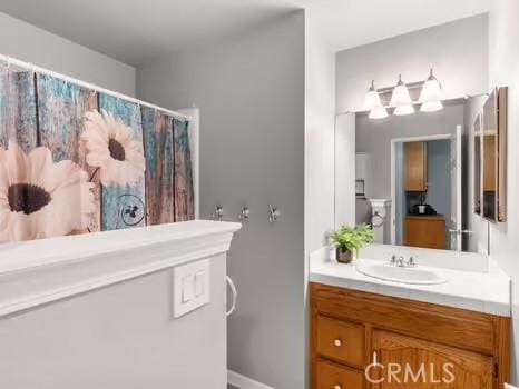 11191 Baker Ln, Riverside, CA 92505 - full bath featuring vanity, baseboards, and a shower with shower curtain