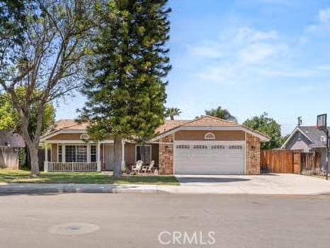11191 Baker Ln, Riverside, CA 92505 - view of front of property featuring an attached garage and concrete driveway