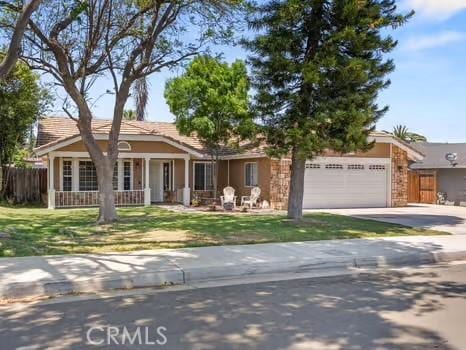 11191 Baker Ln, Riverside, CA 92505 - ranch-style home with an attached garage and concrete driveway